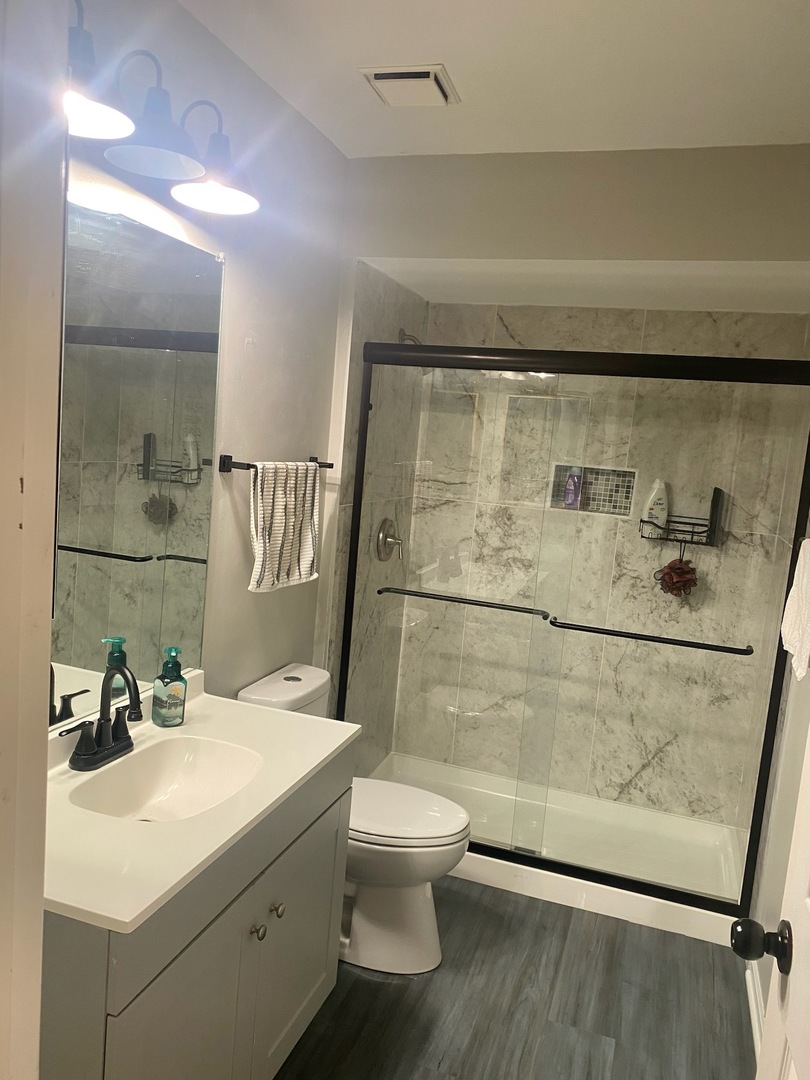 90 Decker Drive Cary, IL 60013 - Photo 10 of 12 a bathroom with a sink a toilet and shower