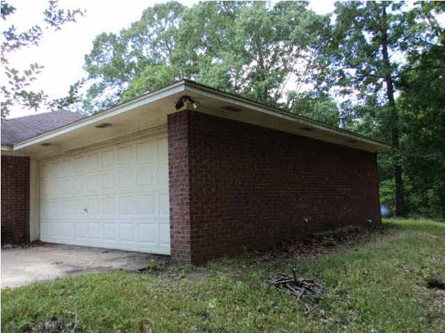 1584 Spring Hill Road Raymond, MS 39154 - Photo 3 of 15 Right side of the house and 2-car garage