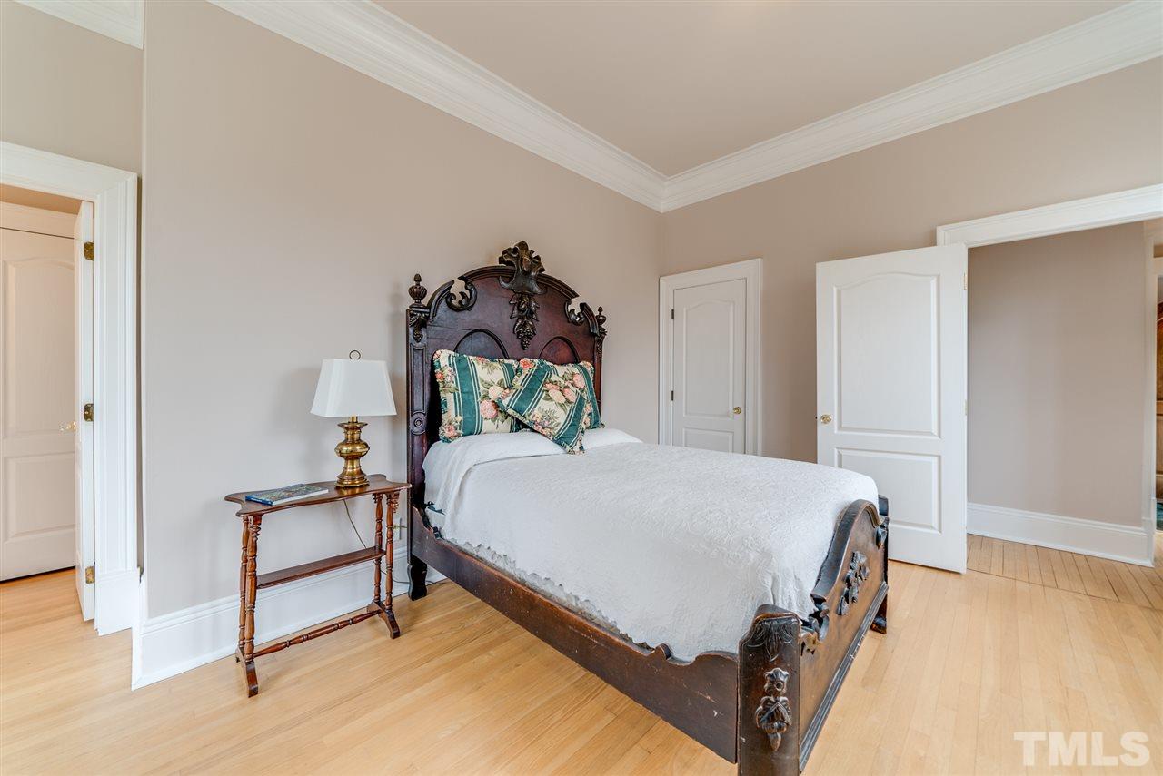 405 Dekoven Place Raleigh, NC 27608 - Photo 12 of 25 Large first floor bedroom with attached, private full bath is big enough to be used as a downstairs master if needed.