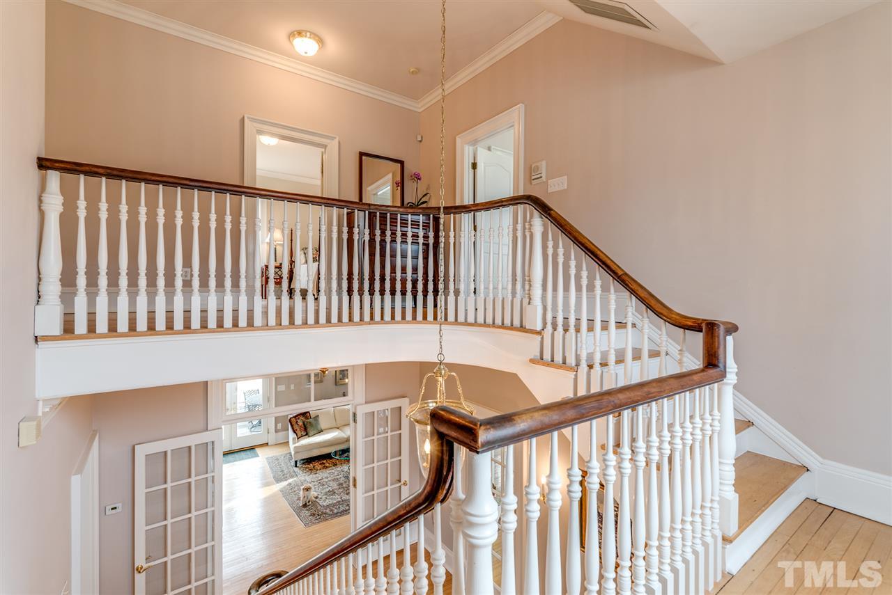 405 Dekoven Place Raleigh, NC 27608 - Photo 14 of 25 Bannister is original to the home. 1st floor boasts 10-1/2 foot ceilings, 2nd floor boasts 9-1/2 foot ceilings!