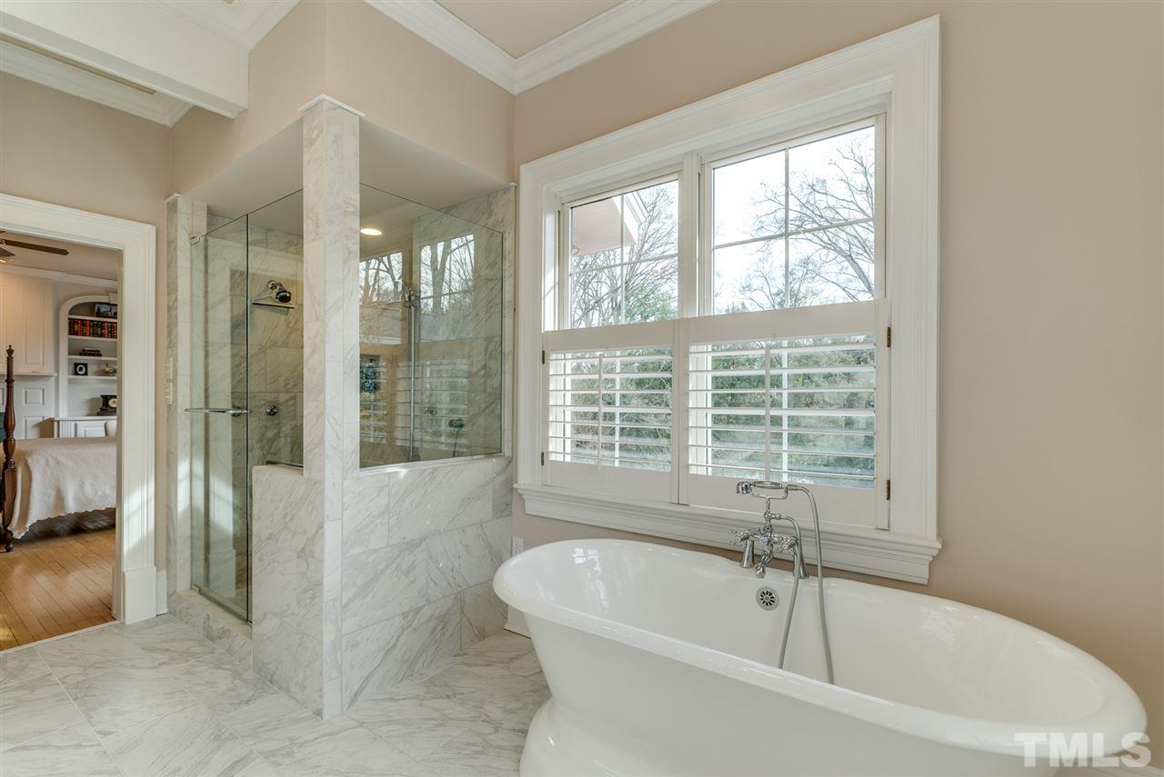 405 Dekoven Place Raleigh, NC 27608 - Photo 17 of 25 Newly renovated master bath with separate tub and shower with 3 shower heads and lots of water pressure!