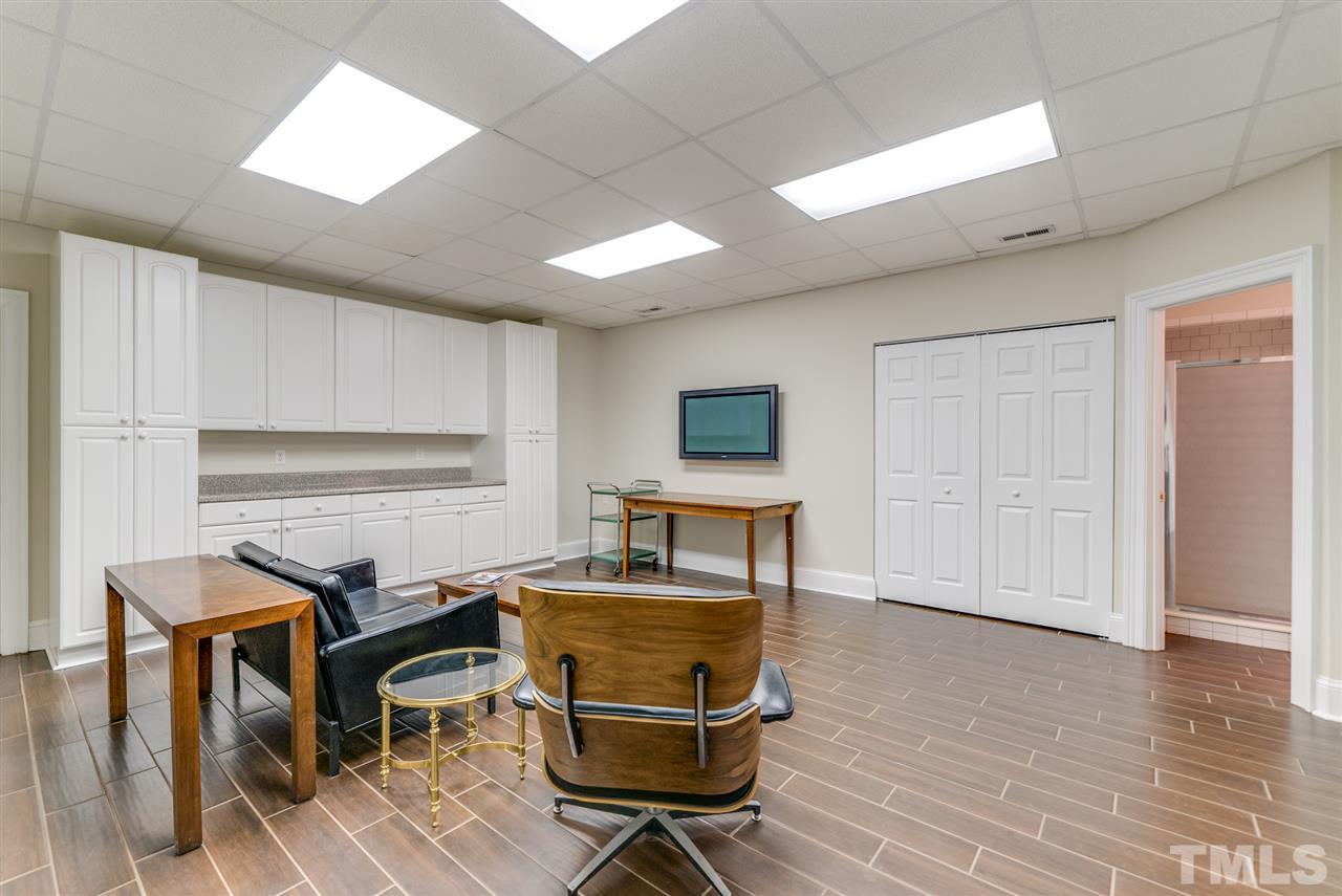 405 Dekoven Place Raleigh, NC 27608 - Photo 22 of 25 Bonus room in basement with full bath and plenty of storage