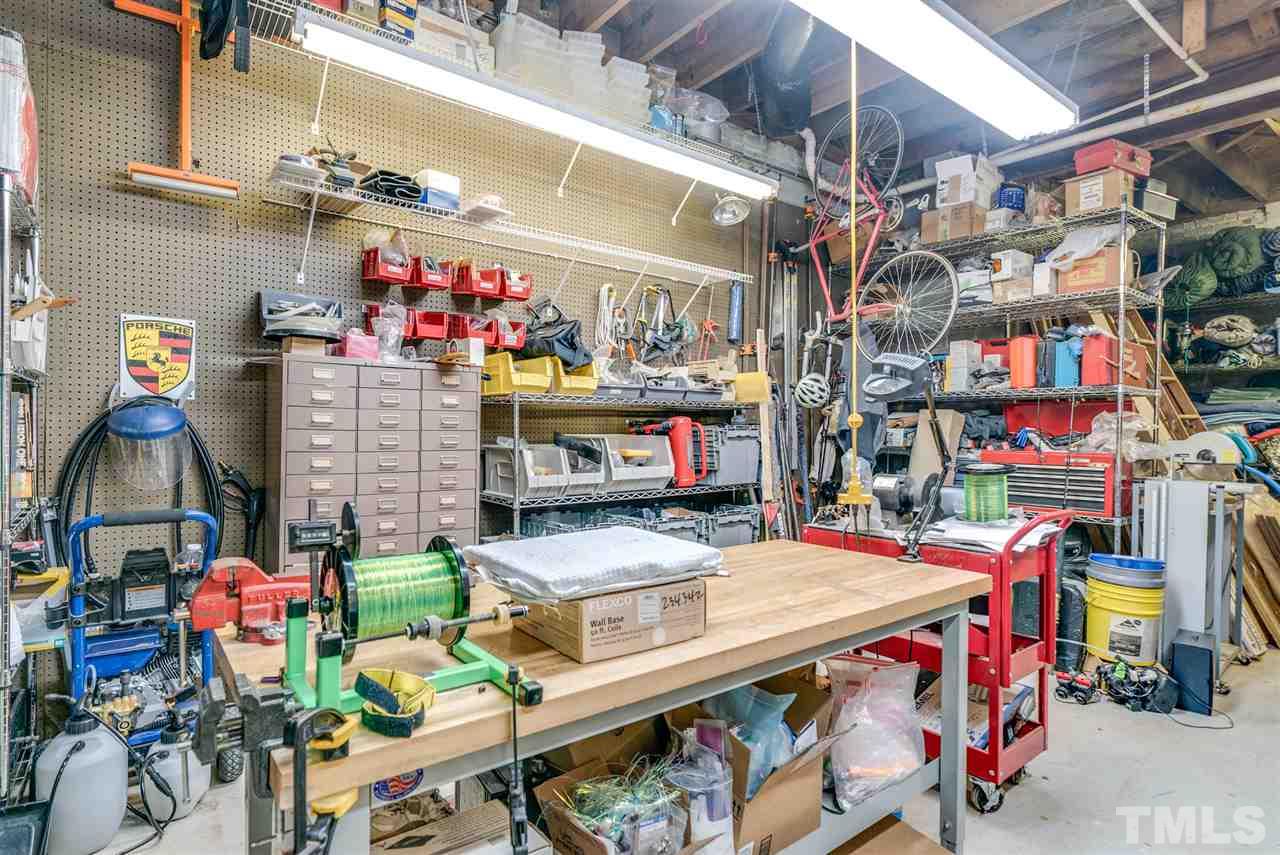 405 Dekoven Place Raleigh, NC 27608 - Photo 23 of 25 Attached workshop in basement gives ample room for hobbies