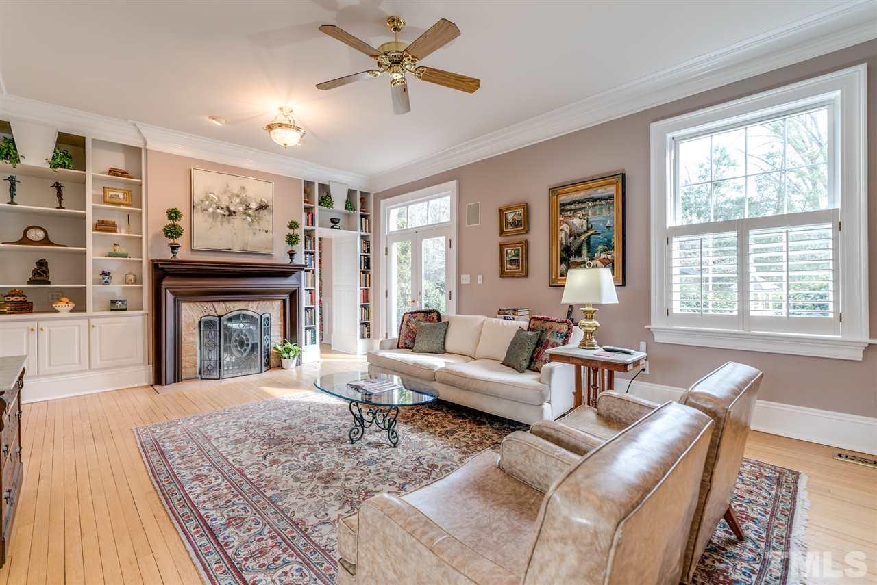 405 Dekoven Place Raleigh, NC 27608 - Photo 5 of 25 Built in bookcases and working fireplace, one of three in the home.