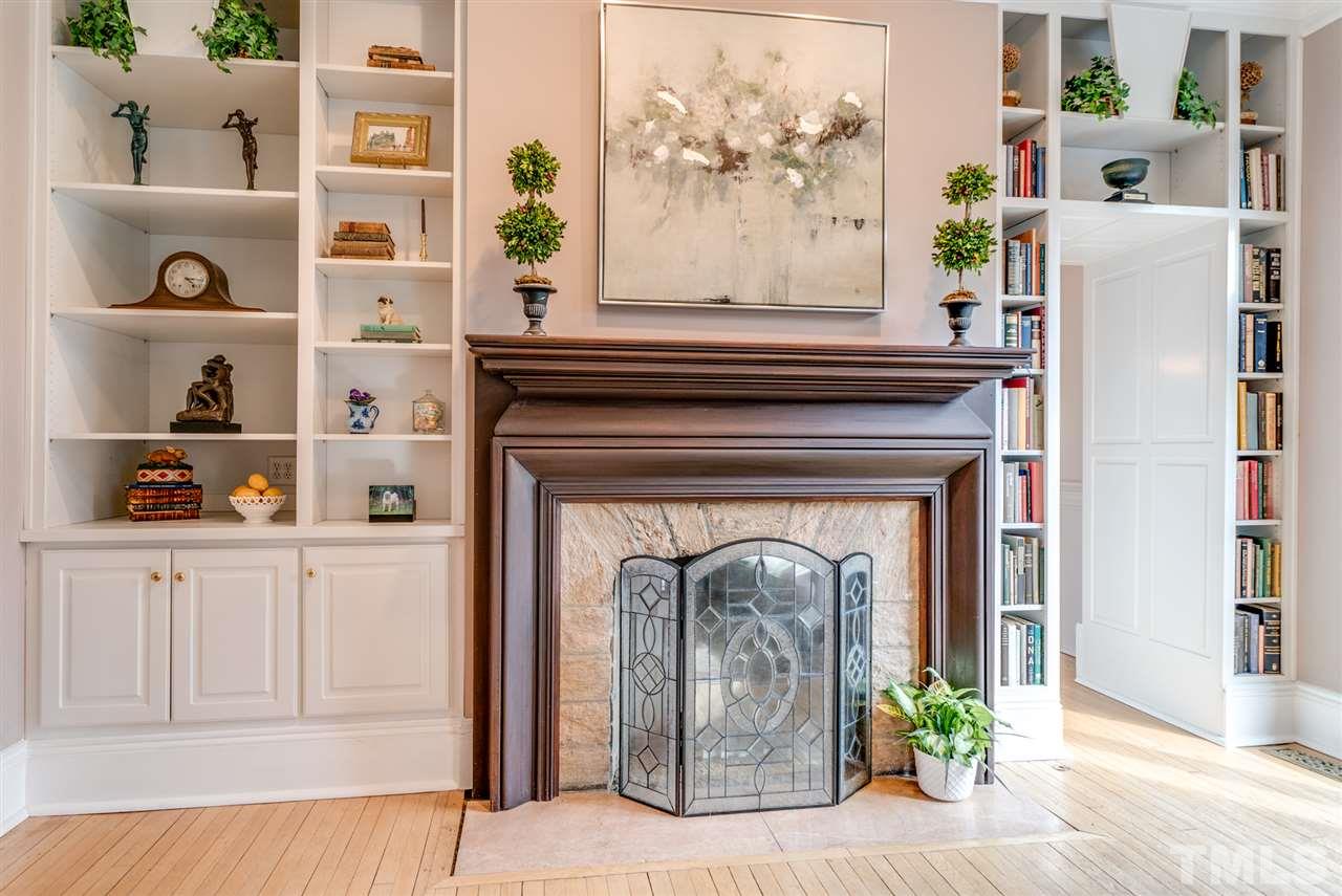 405 Dekoven Place Raleigh, NC 27608 - Photo 6 of 25 Mantle is original to the home, Wake County granite on the surround.