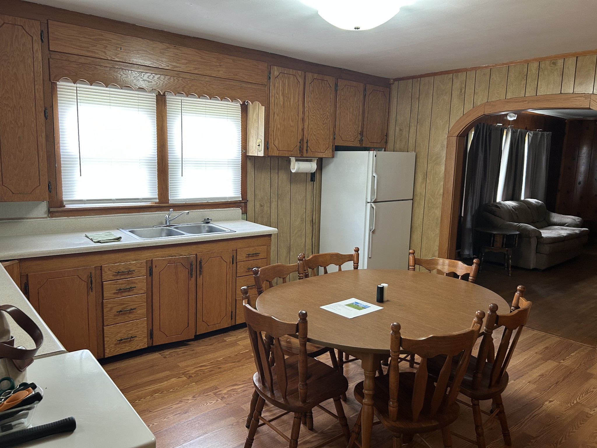 150 Chestnut Street Iron City, TN 38463 - Photo 14 of 29 a kitchen with stainless steel appliances granite countertop a stove a refrigerator a sink a dining table and chairs