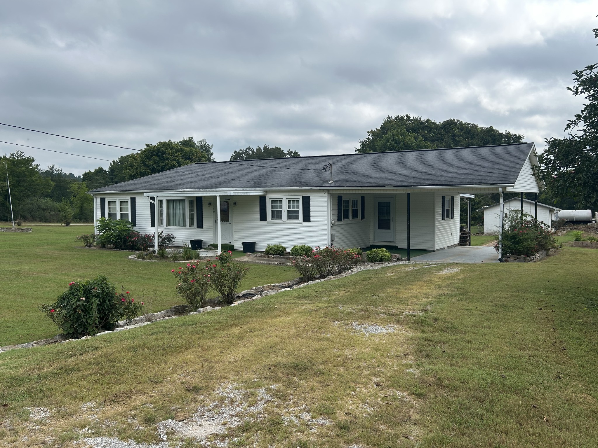 150 Chestnut Street Iron City, TN 38463 - Photo 2 of 29 a view of a house with a yard