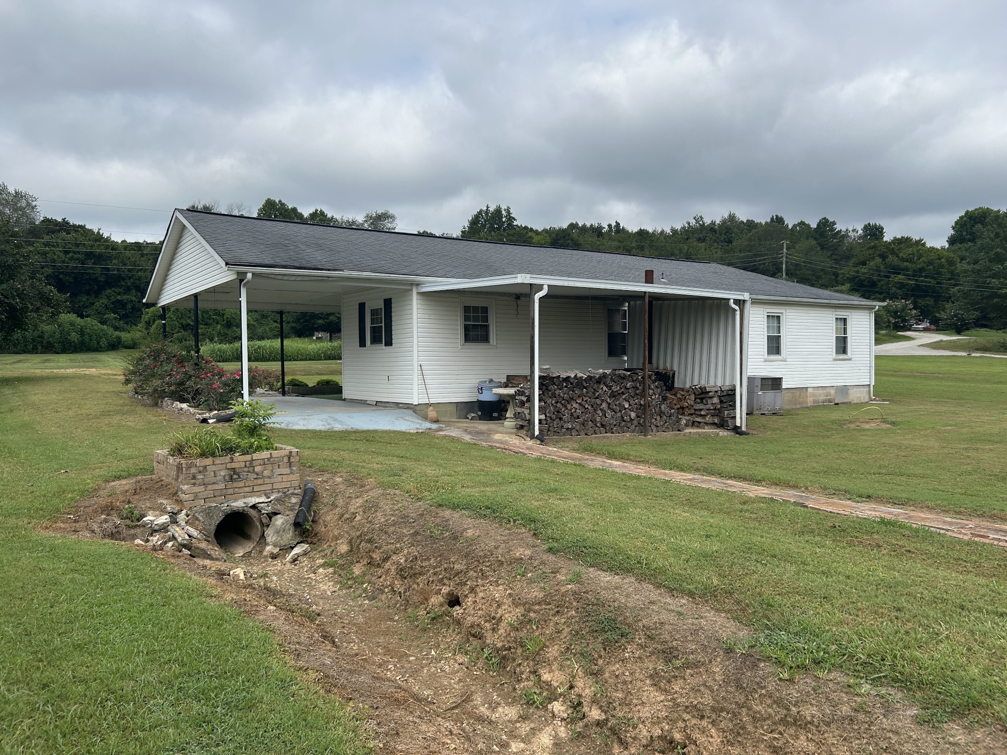 150 Chestnut Street Iron City, TN 38463 - Photo 5 of 29 a front view of a house with garden