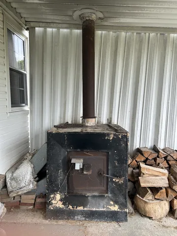 a room with a fireplace and a window
