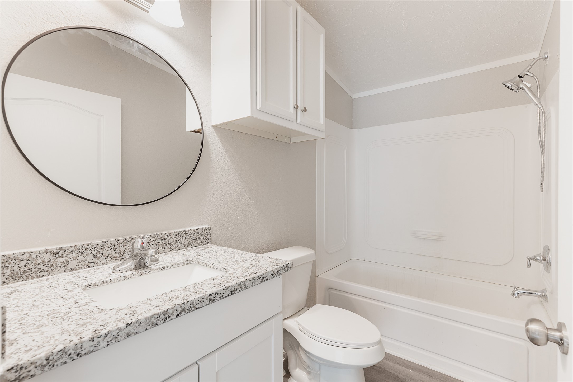 1520 West Creek Drive Conroe, TX 77304 - Photo 16 of 29 a bathroom with a granite countertop sink mirror vanity and toilet
