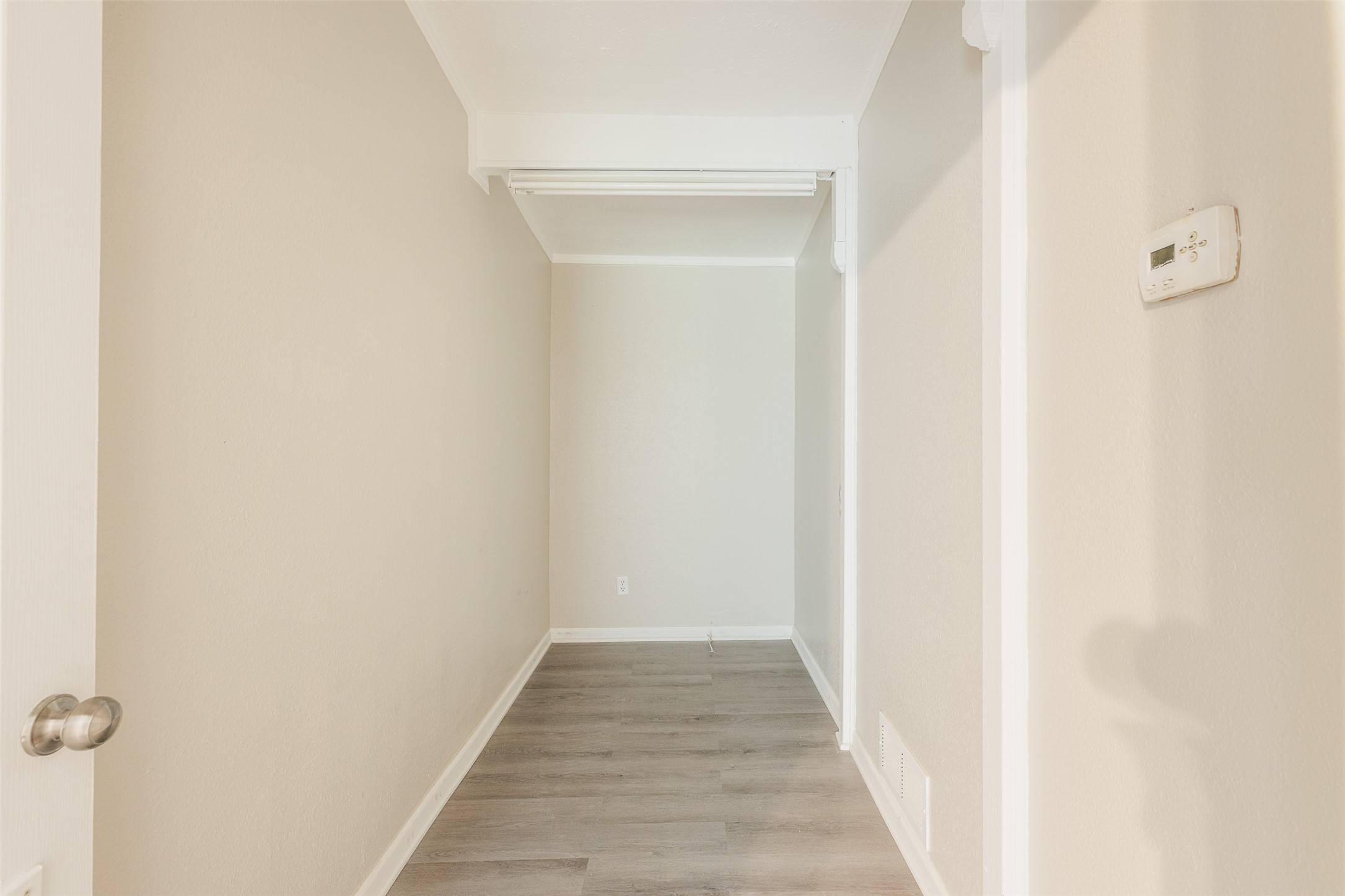 1520 West Creek Drive Conroe, TX 77304 - Photo 4 of 29 a view of a hallway with wooden floor