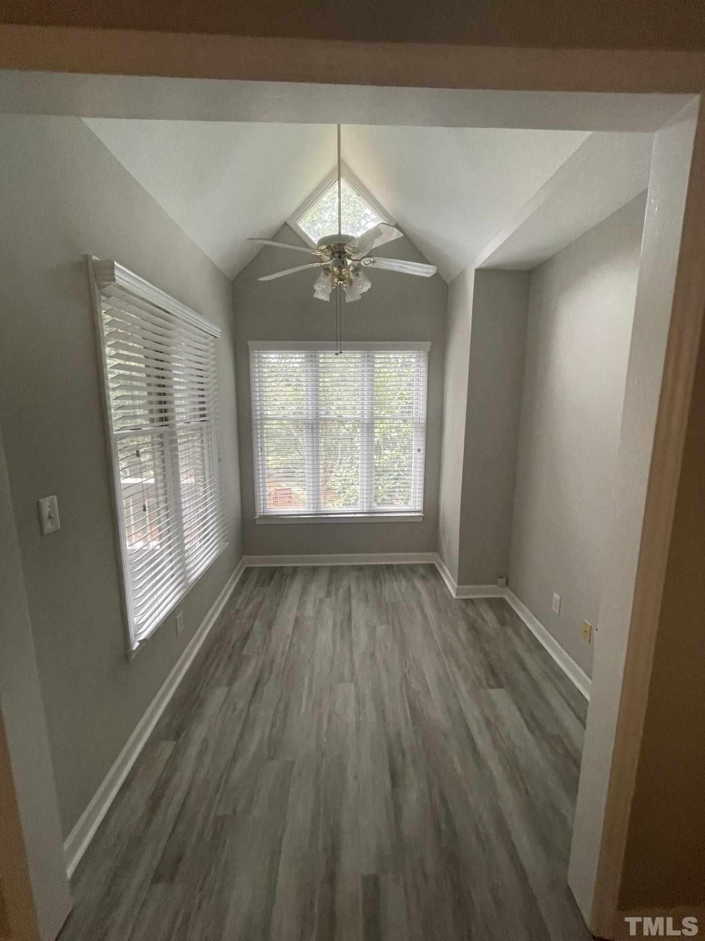 243 New Bern Place, Unit 301 Raleigh, NC 27601 - Photo 19 of 19 wooden floor in an empty room with a window