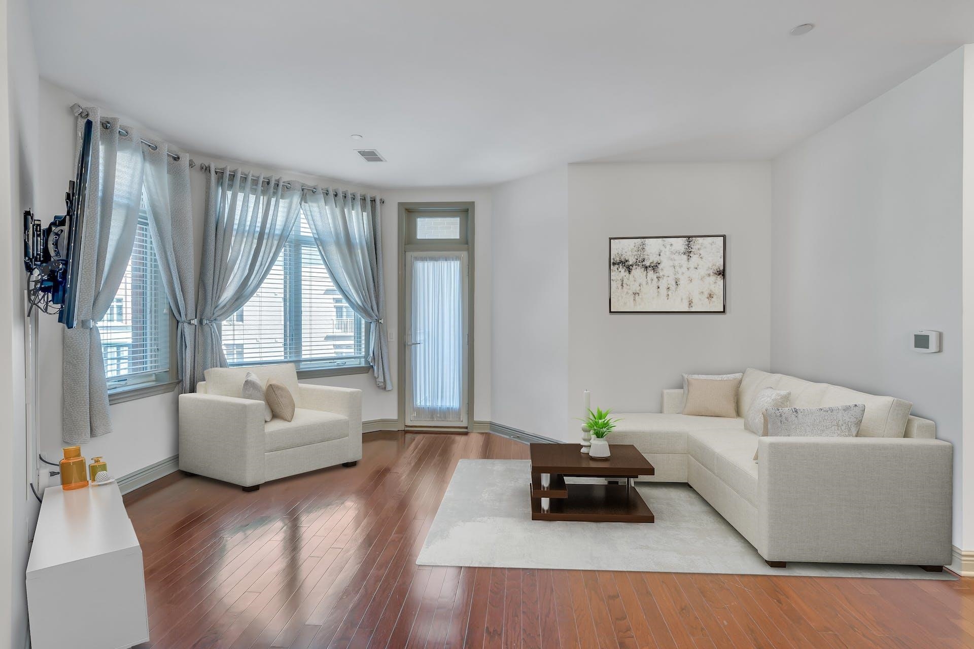 7400 River Road, Unit 315 North Bergen, NJ 07047 - Photo 2 of 19 a living room with furniture and a large window
