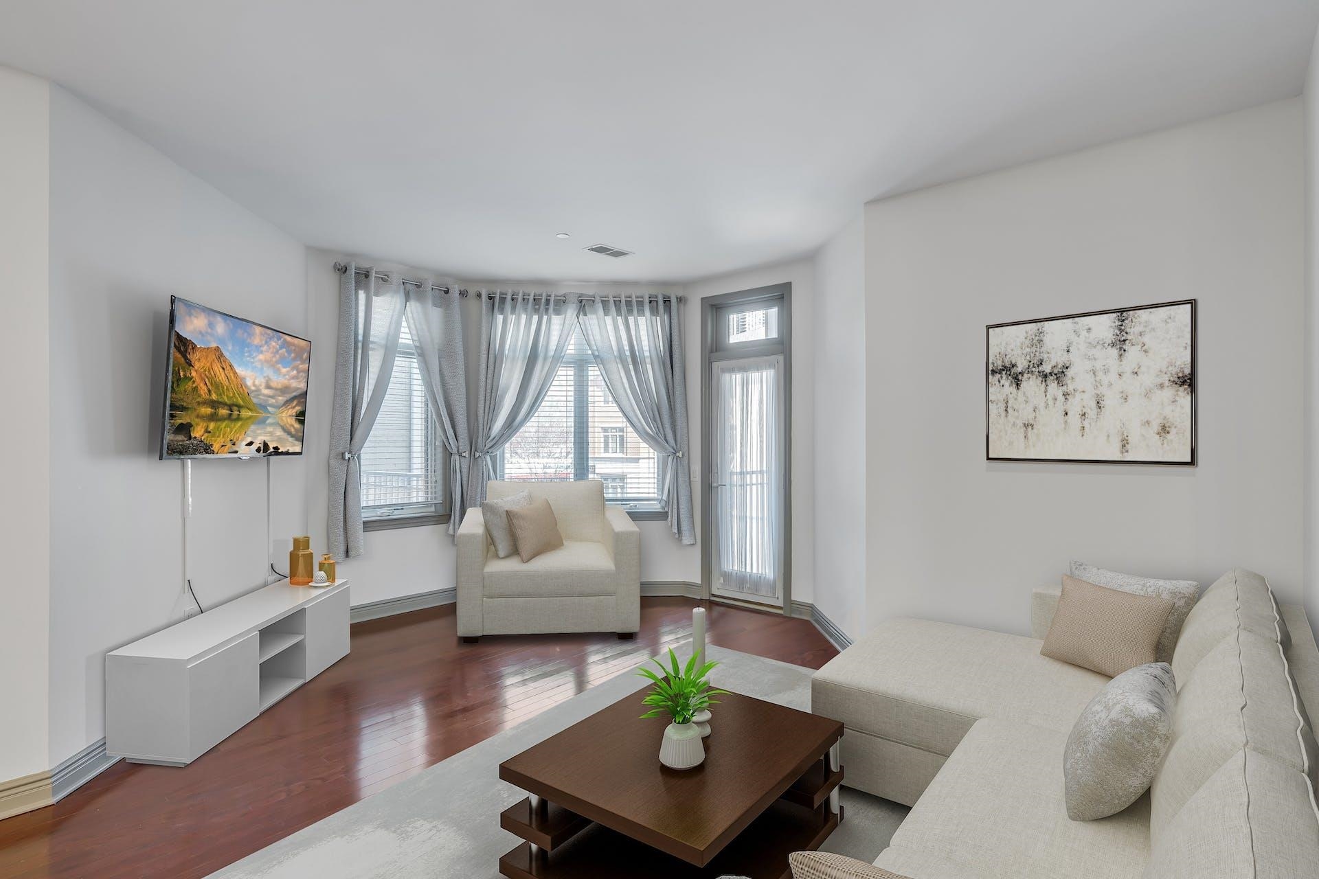 7400 River Road, Unit 315 North Bergen, NJ 07047 - Photo 3 of 19 a living room with furniture and a wooden floor