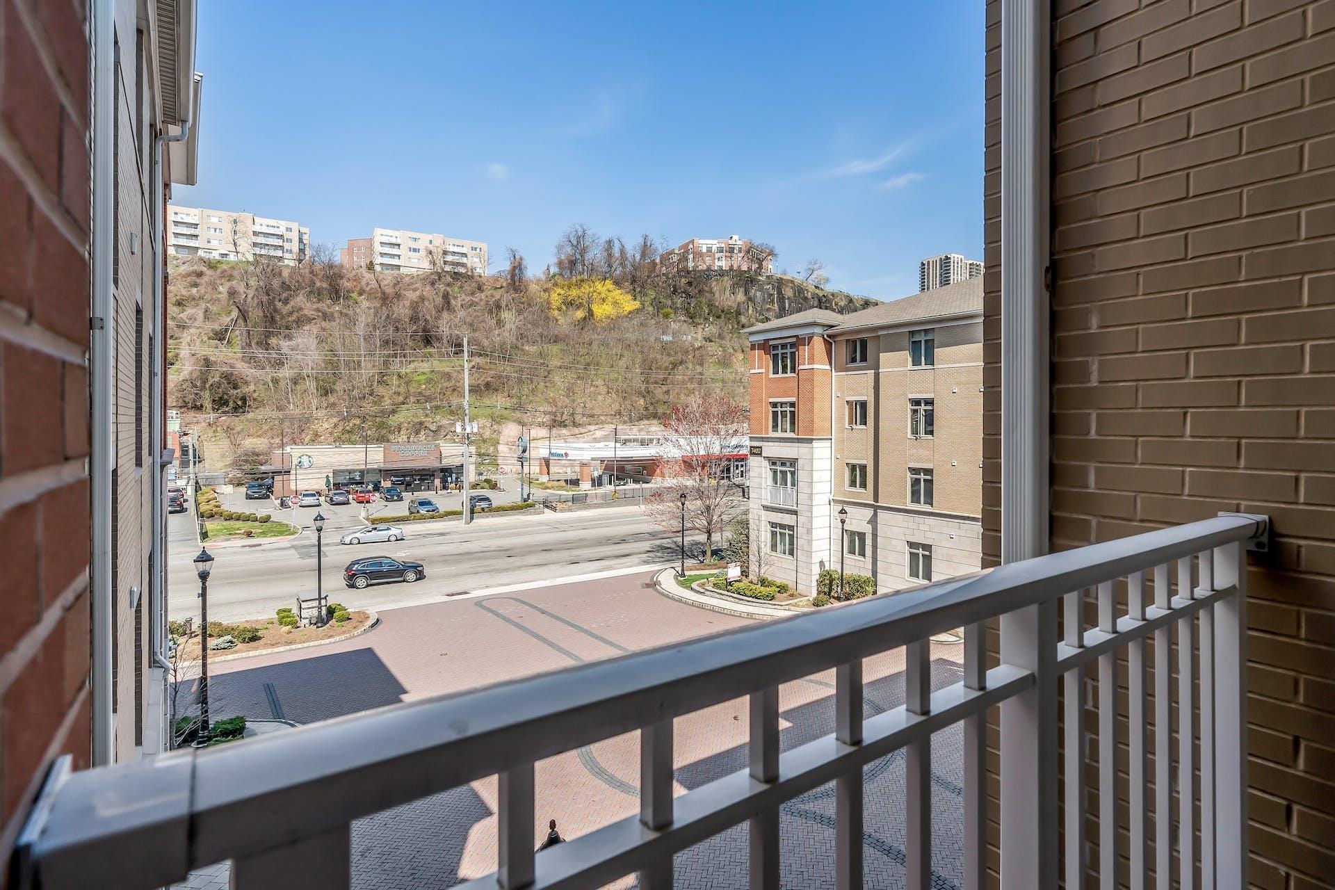 7400 River Road, Unit 315 North Bergen, NJ 07047 - Photo 8 of 19 a city view from a balcony with city view