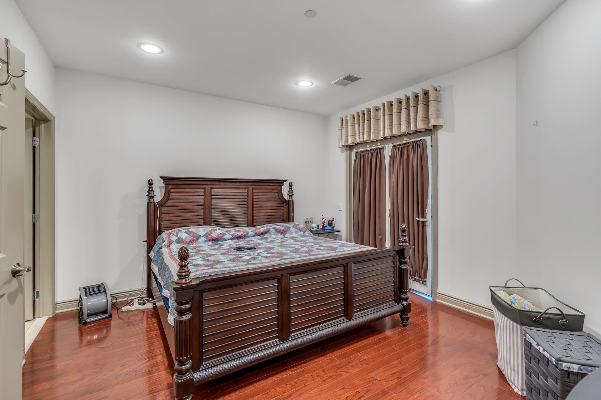 7400 River Road, Unit 315 North Bergen, NJ 07047 - Photo 9 of 19 a bedroom with a bed and wooden floor