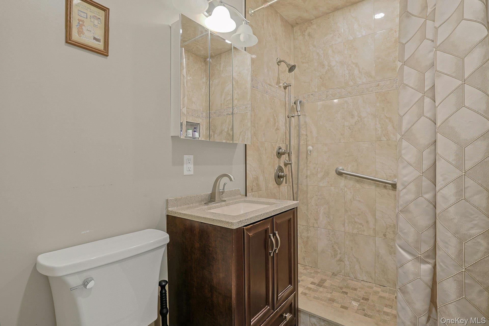 31 Townline Road Pearl River, NY 10965 - Photo 17 of 27 a bathroom with a sink a toilet and shower
