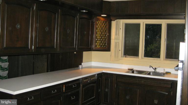 13105 Bottom Road Hydes, MD 21082 - Photo 14 of 22 a kitchen with a sink and cabinets