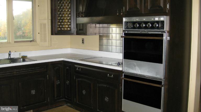 13105 Bottom Road Hydes, MD 21082 - Photo 5 of 22 a kitchen with a sink and a stove