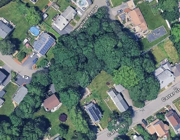 an aerial view of residential house with outdoor space and street view