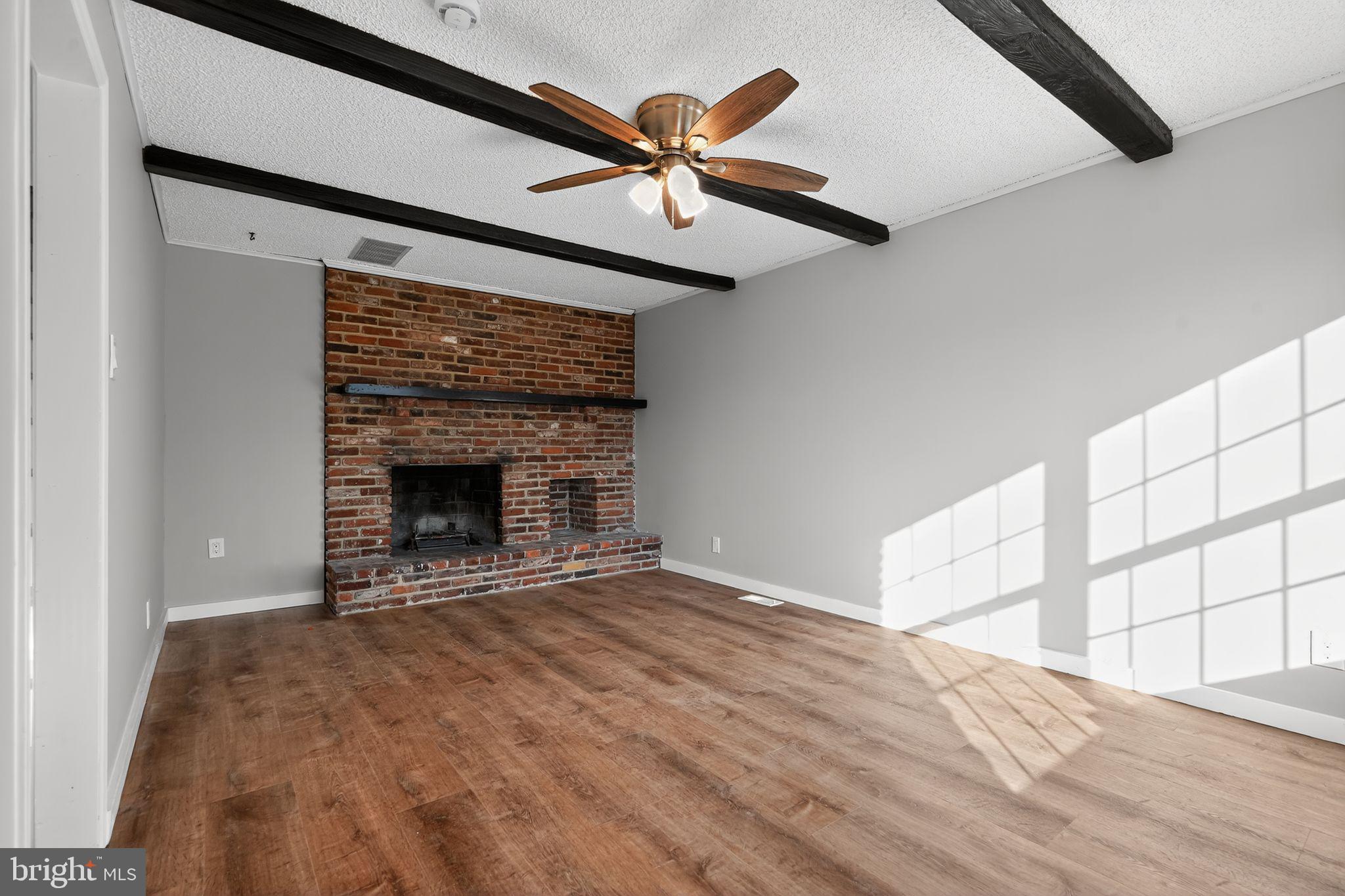 14 Benner Road Blackwood, NJ 08012 - Photo 12 of 32 a view of an empty room with a fireplace and a window