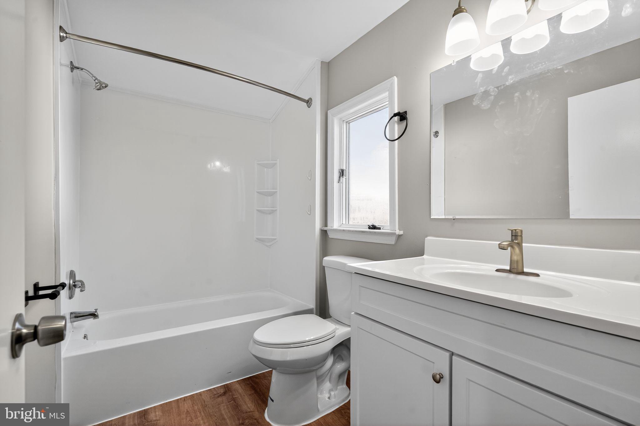 14 Benner Road Blackwood, NJ 08012 - Photo 13 of 32 a bathroom with a sink a toilet and a bathtub