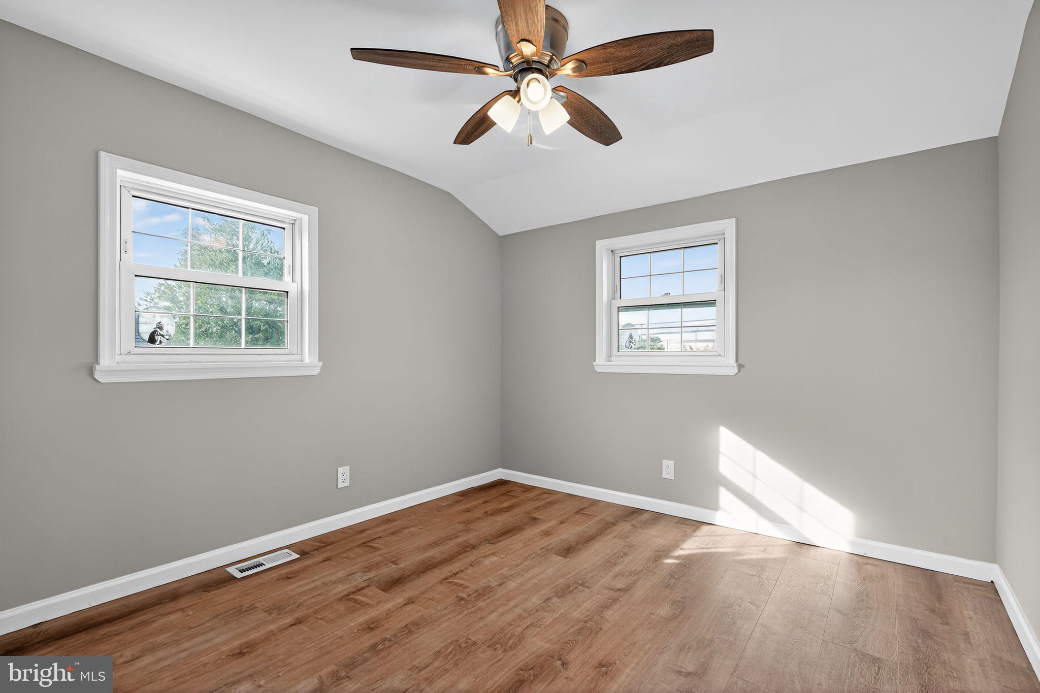 14 Benner Road Blackwood, NJ 08012 - Photo 14 of 32 a view of an empty room with window and wooden floor