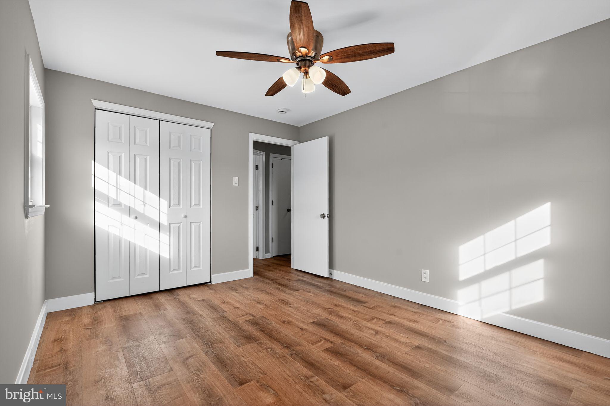 14 Benner Road Blackwood, NJ 08012 - Photo 24 of 32 a view of empty room with wooden floor and fan
