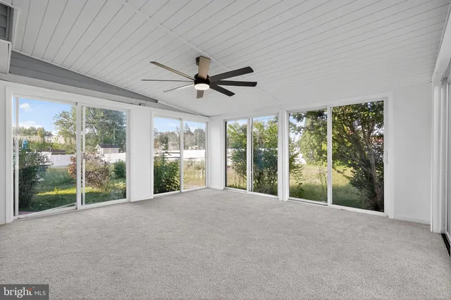 a view of an empty room with windows