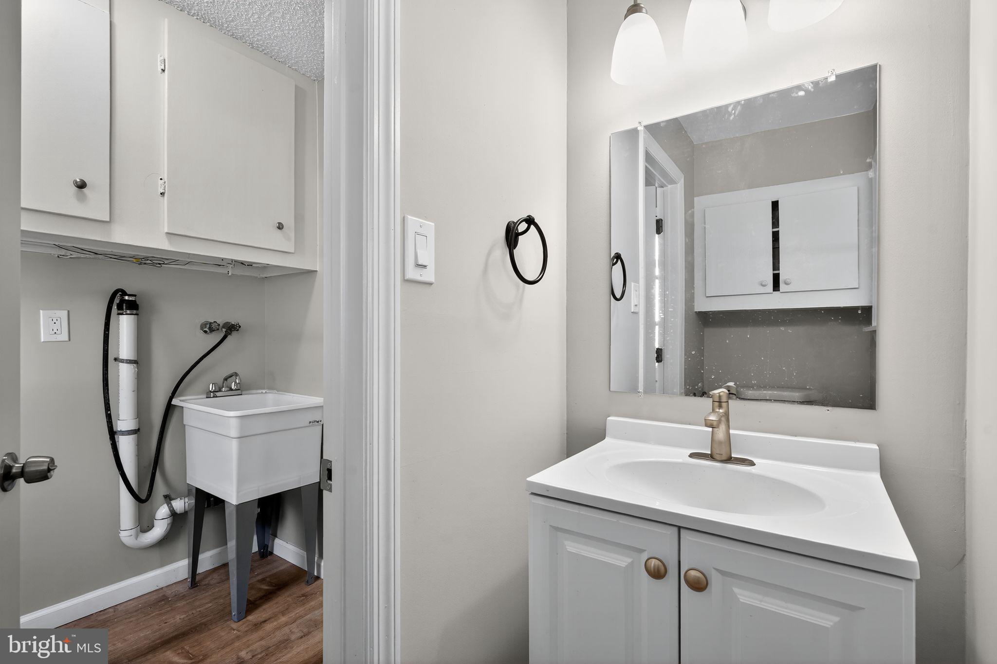 14 Benner Road Blackwood, NJ 08012 - Photo 29 of 32 a bathroom with a sink a toilet and mirror
