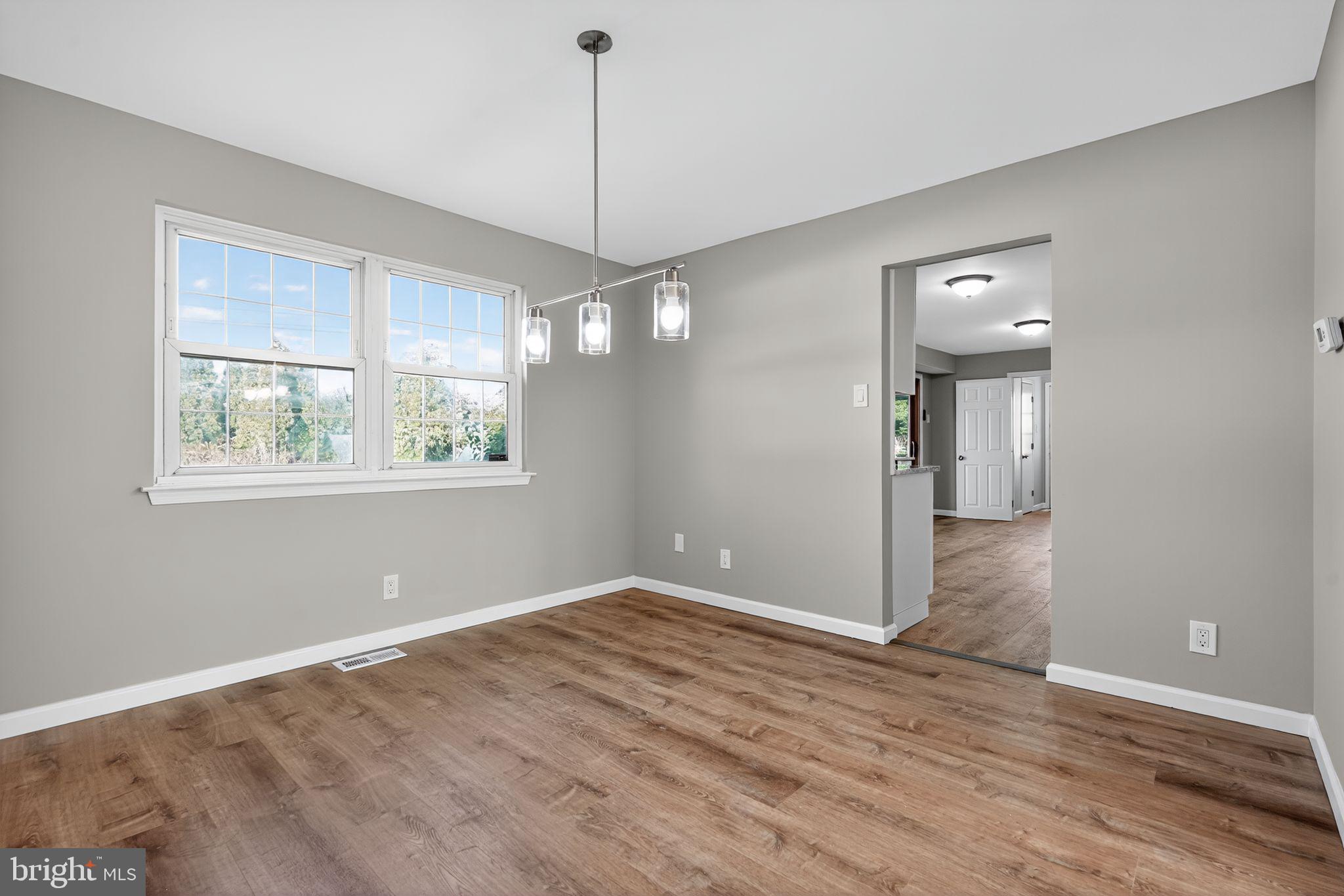 14 Benner Road Blackwood, NJ 08012 - Photo 5 of 32 a view of empty room with wooden floor and fan