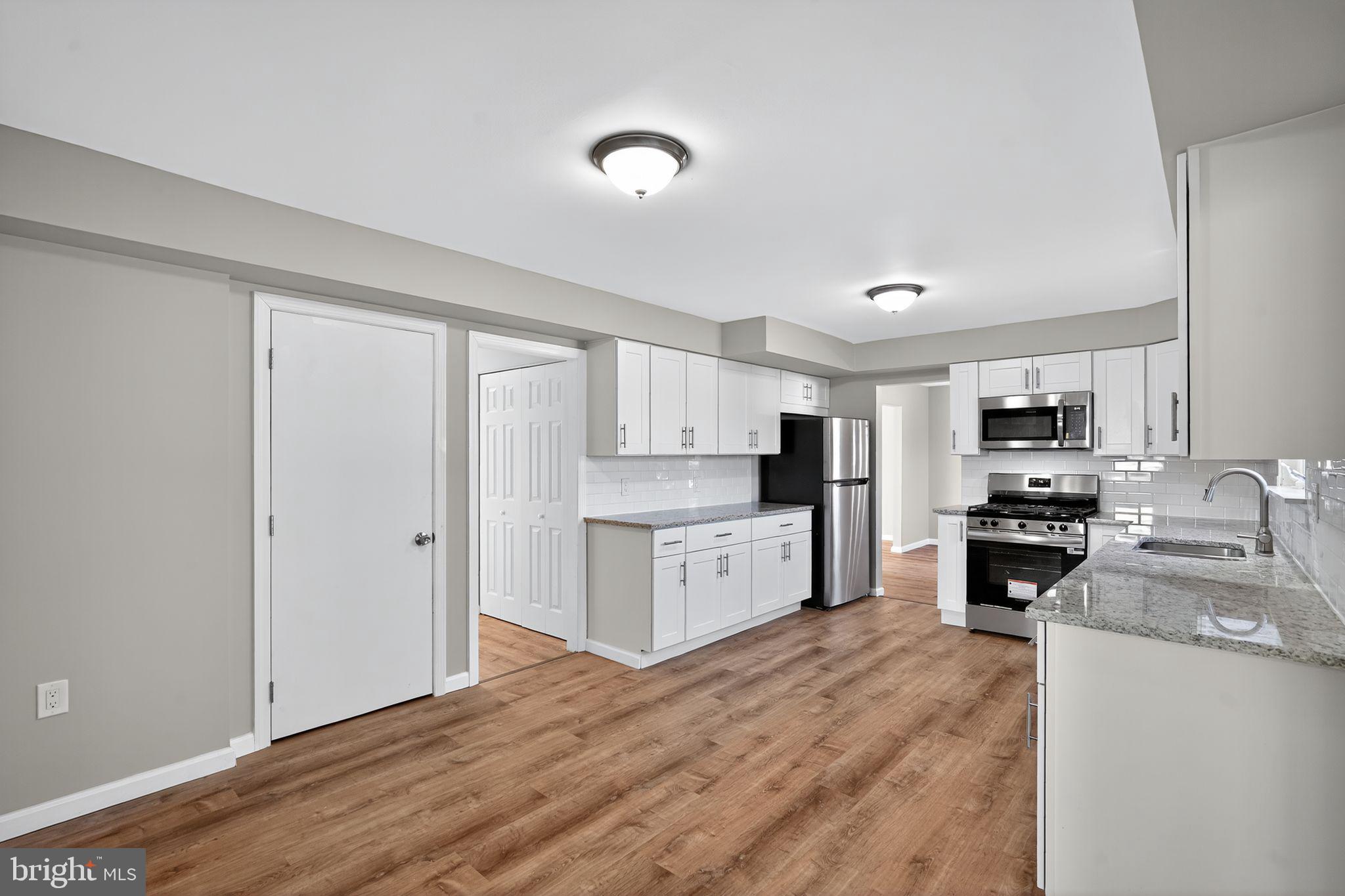 14 Benner Road Blackwood, NJ 08012 - Photo 8 of 32 a kitchen with a refrigerator stove top oven and sink
