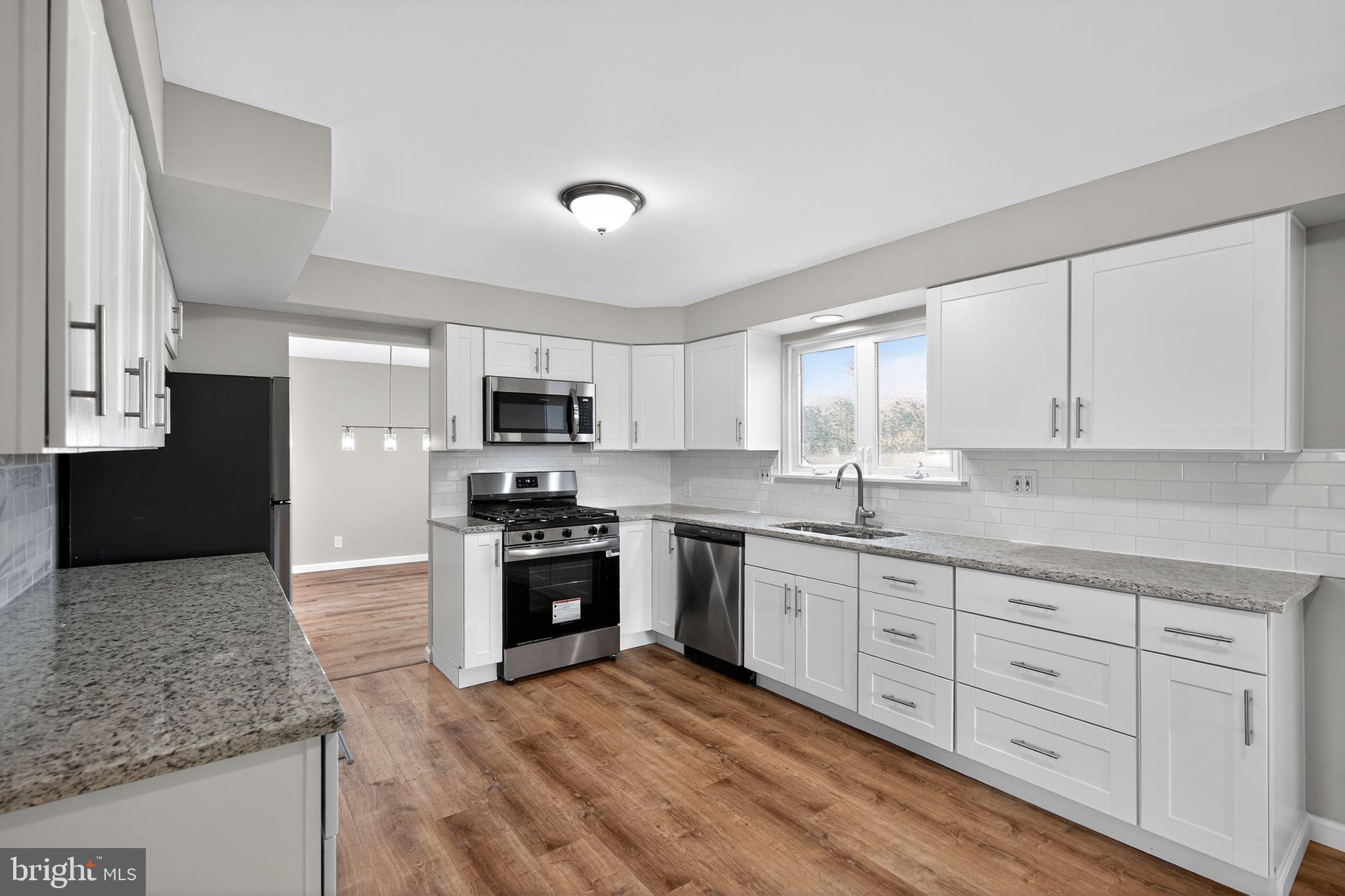 14 Benner Road Blackwood, NJ 08012 - Photo 10 of 32 a kitchen with granite countertop a sink stainless steel appliances and cabinets