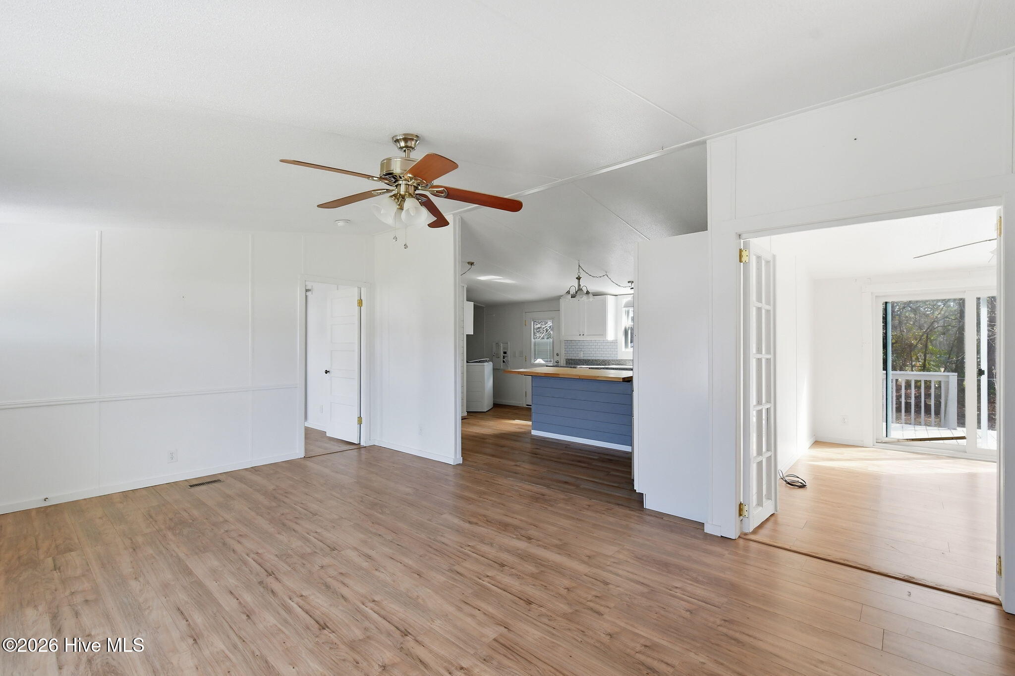 2228 Harbor Ridge Drive Southeast Bolivia, NC 28422 - Photo 3 of 30 Family Room Looking towards Kitchen and Primary Bedroom
