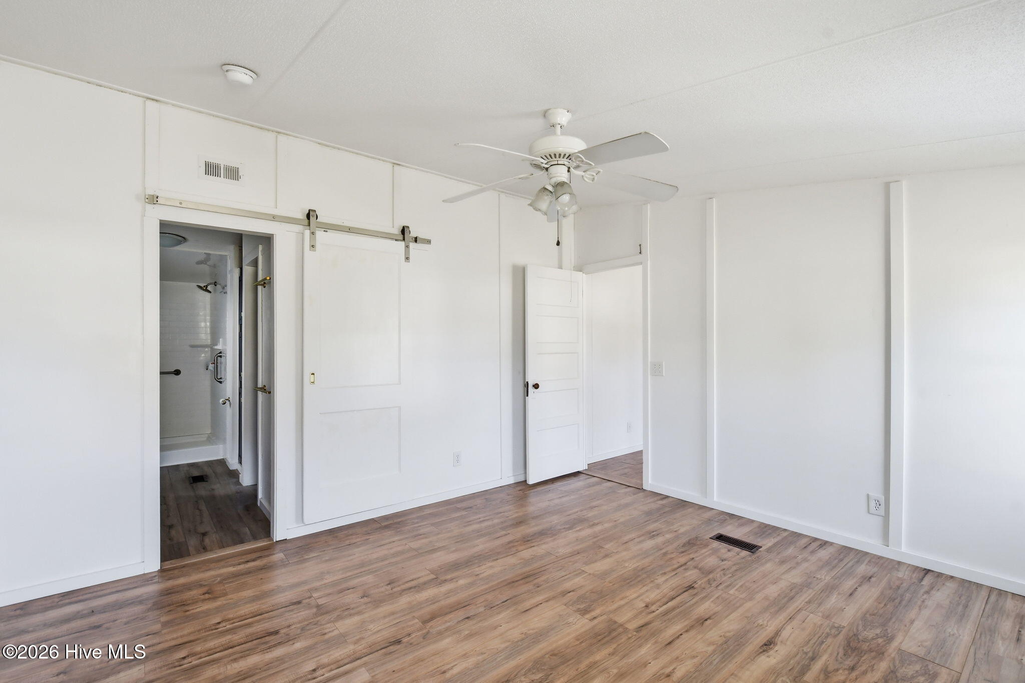 2228 Harbor Ridge Drive Southeast Bolivia, NC 28422 - Photo 6 of 30 Primary Bedroom looking towards bathroom and family room
