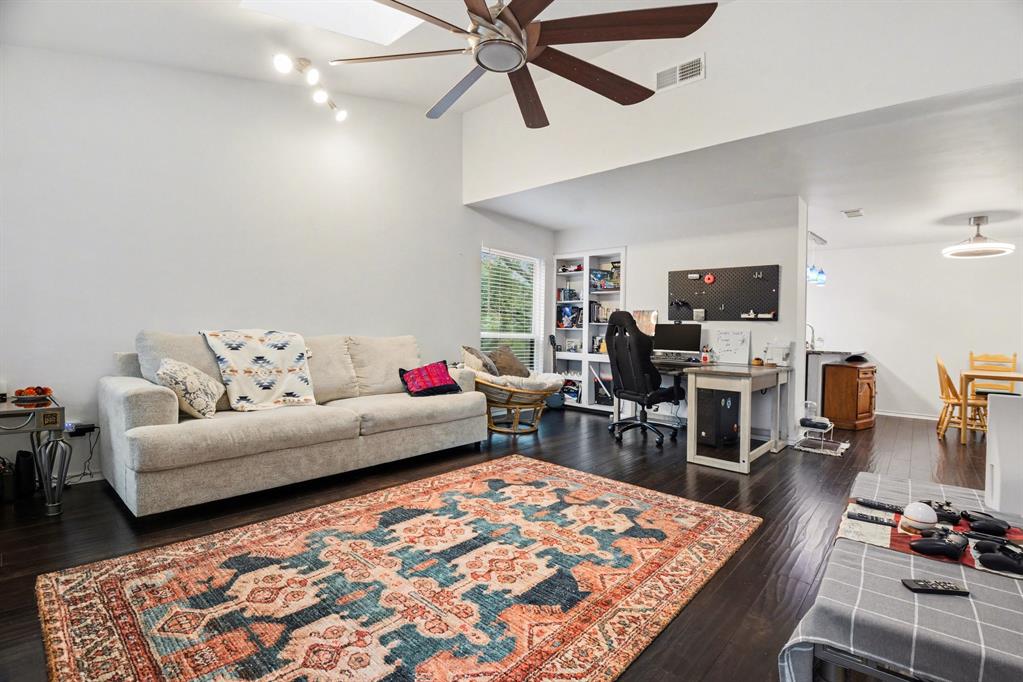 5616 Preston Oaks Road, Unit 102 Dallas, TX 75254 - Photo 2 of 11 a living room with furniture and wooden floor