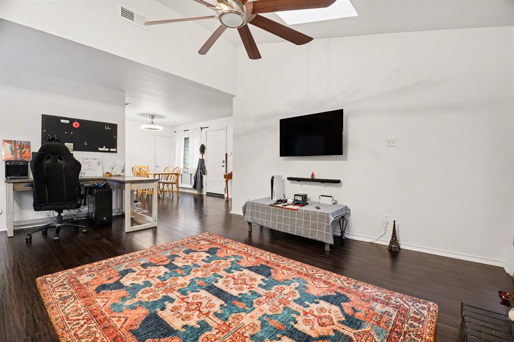 5616 Preston Oaks Road, Unit 102 Dallas, TX 75254 - Photo 3 of 11 a living room with furniture and a flat screen tv