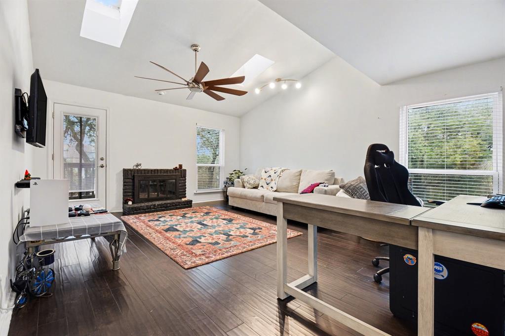 5616 Preston Oaks Road, Unit 102 Dallas, TX 75254 - Photo 4 of 11 a view of a workspace with furniture and a flat screen tv