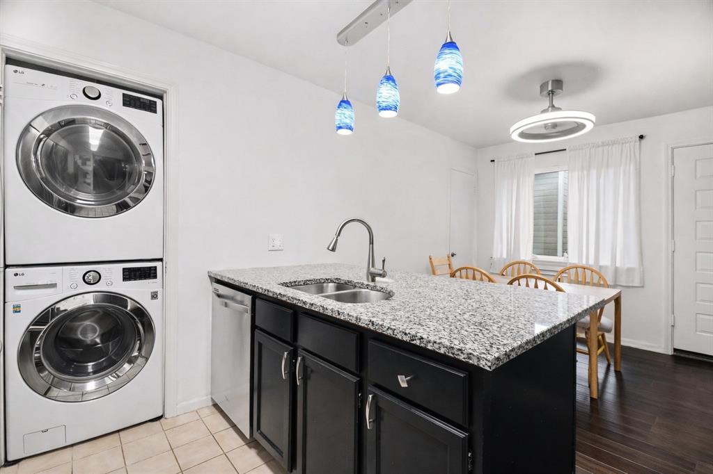5616 Preston Oaks Road, Unit 102 Dallas, TX 75254 - Photo 7 of 11 a view of a kitchen area with furniture and wooden floor
