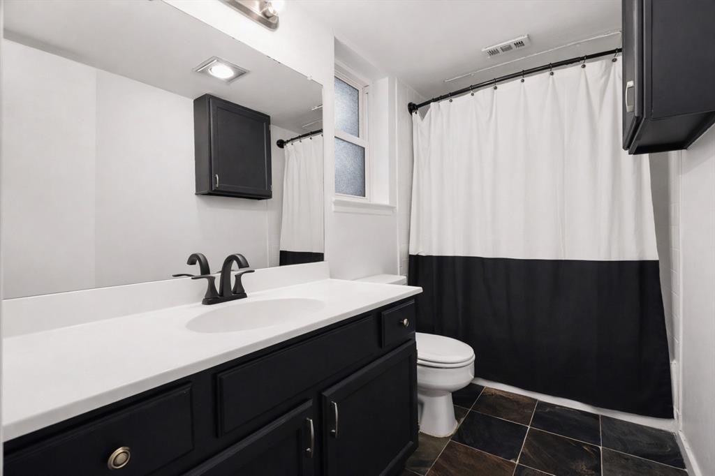 5616 Preston Oaks Road, Unit 102 Dallas, TX 75254 - Photo 9 of 11 a bathroom with a sink a toilet and mirror