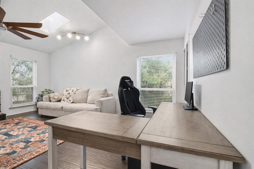 5616 Preston Oaks Road, Unit 102 Dallas, TX 75254 - Photo 10 of 11 a living room with furniture and a window