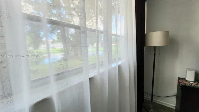 a bathroom with a shower toilet and sink