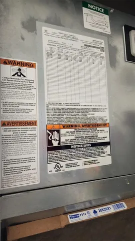 a view of a hallway with closet and a window