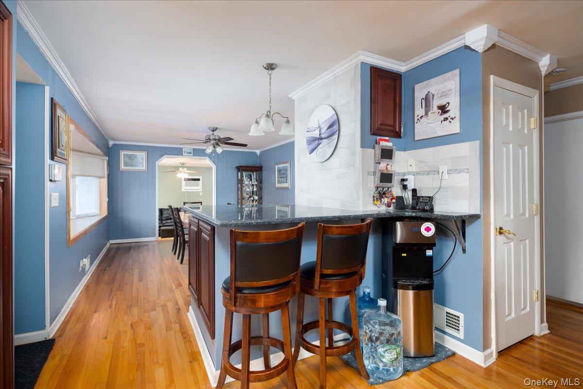 11 Adelphi Road Hicksville, NY 11801 - Photo 8 of 26 a view of a dining room with furniture and wooden floor