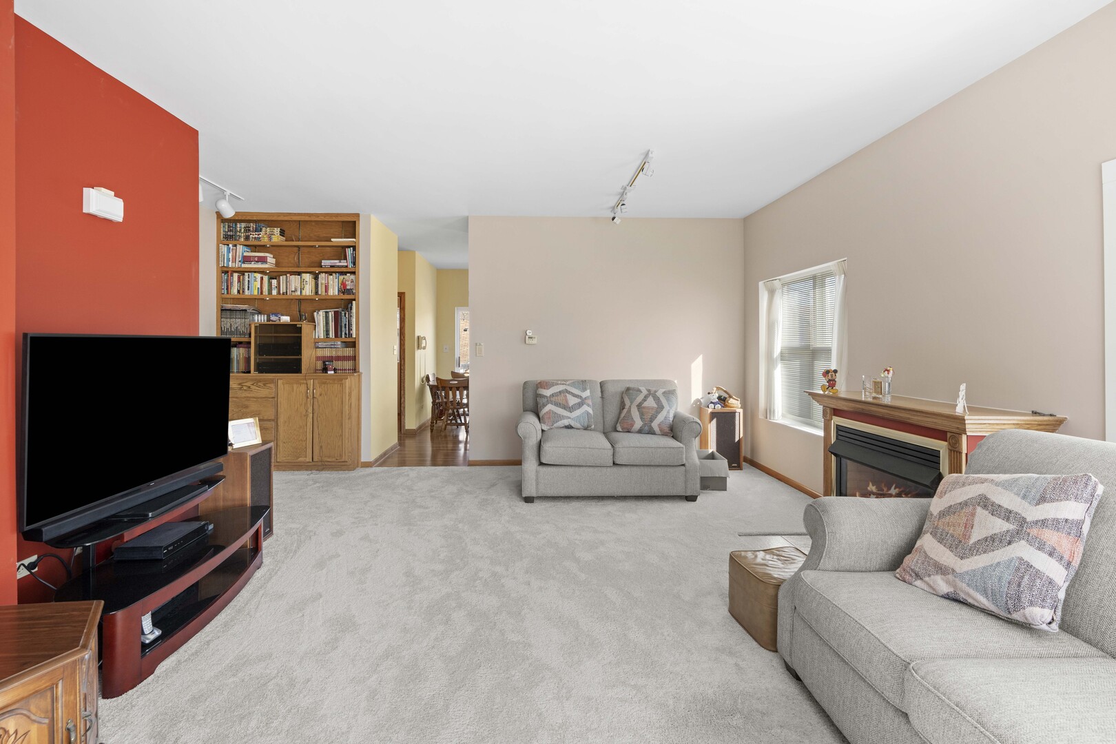 18134 Martin Avenue Homewood, IL 60430 - Photo 13 of 29 a living room with furniture and a flat screen tv
