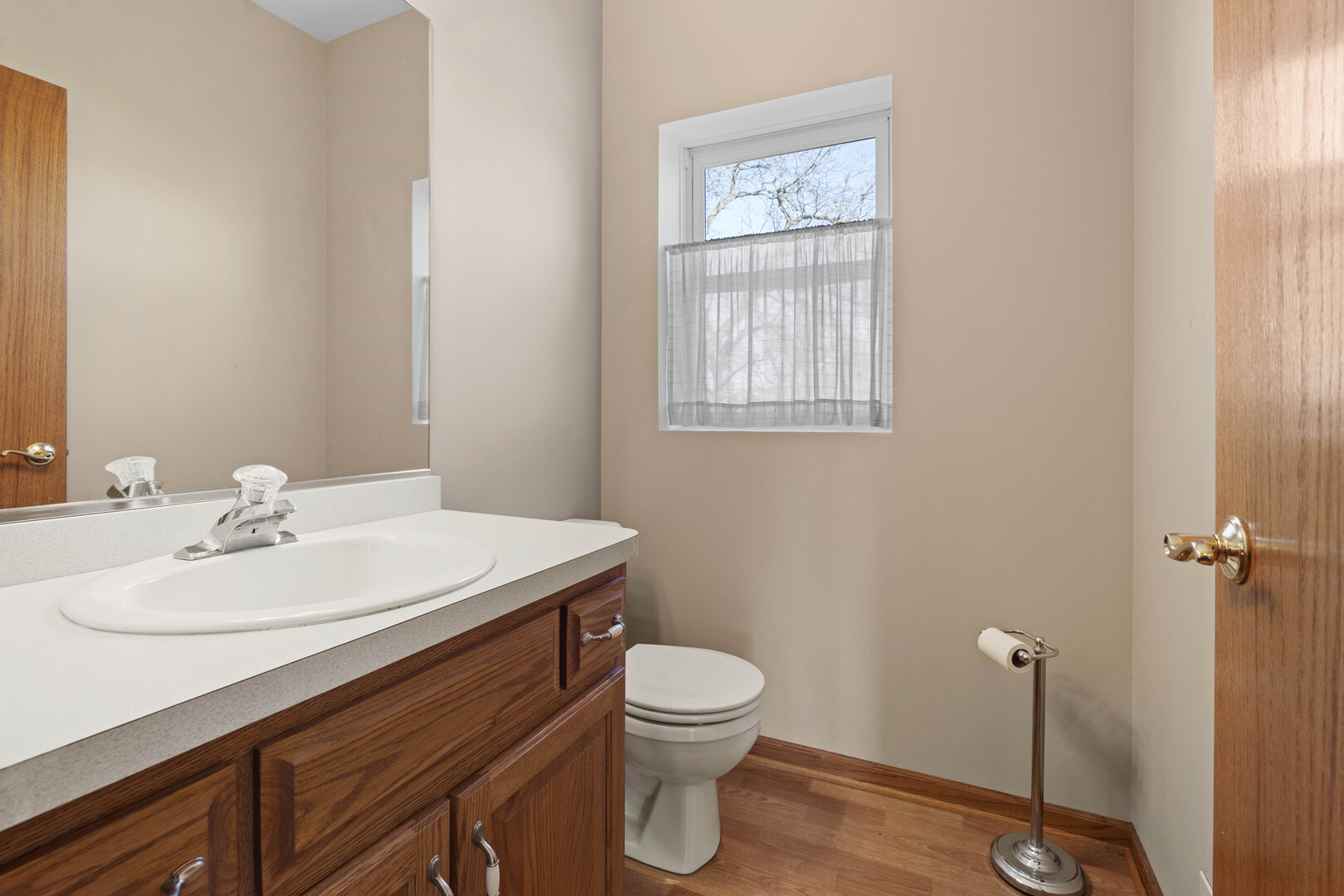 18134 Martin Avenue Homewood, IL 60430 - Photo 15 of 29 a bathroom with a sink toilet and vanity