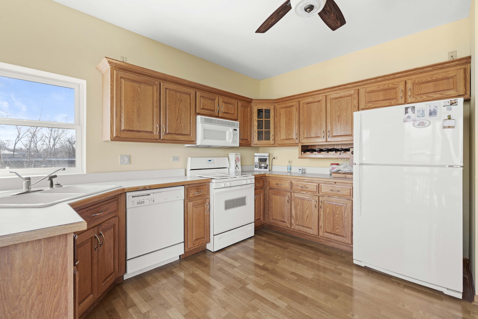 18134 Martin Avenue Homewood, IL 60430 - Photo 5 of 29 a kitchen with white cabinets and white appliances
