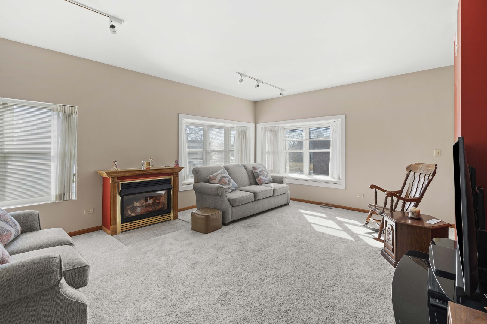 18134 Martin Avenue Homewood, IL 60430 - Photo 10 of 29 a living room with furniture a flat screen tv and a window