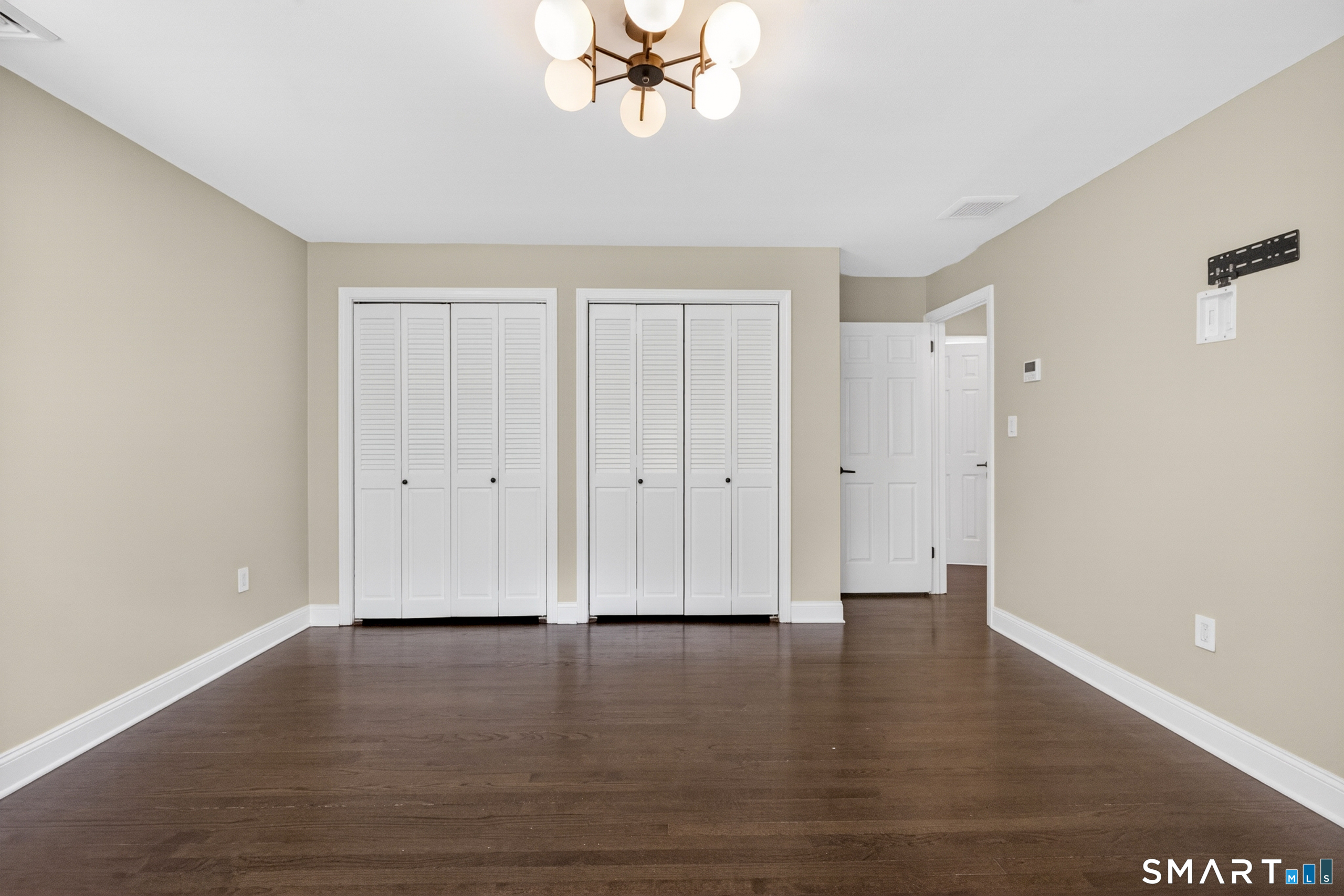 568 Wiese Road Cheshire, CT 06410 - Photo 19 of 40 a view of wooden floor and windows in a room