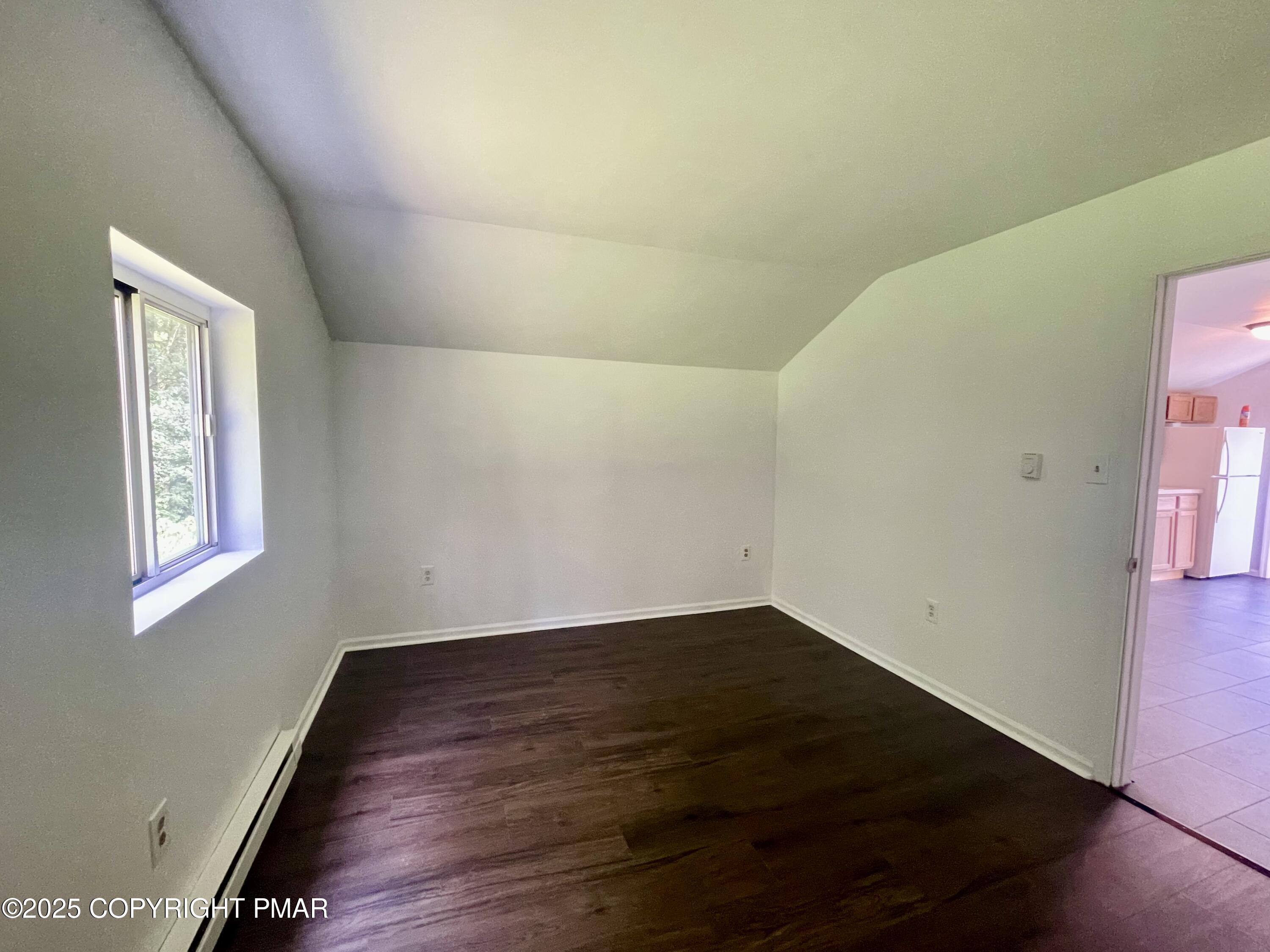 3284 Highway 115, Unit 4 Effort, PA 18330 - Photo 3 of 8 a view of an empty room with wooden floor and a window